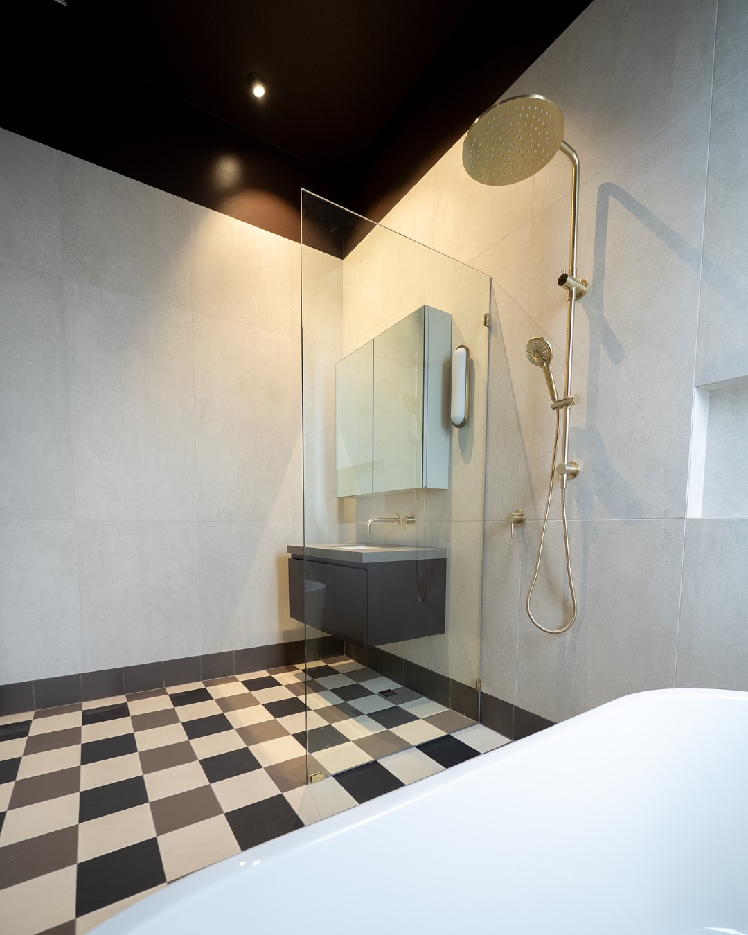 Frameless glass shower, black ceiling and vanity in an Adelaide bathroom renovation