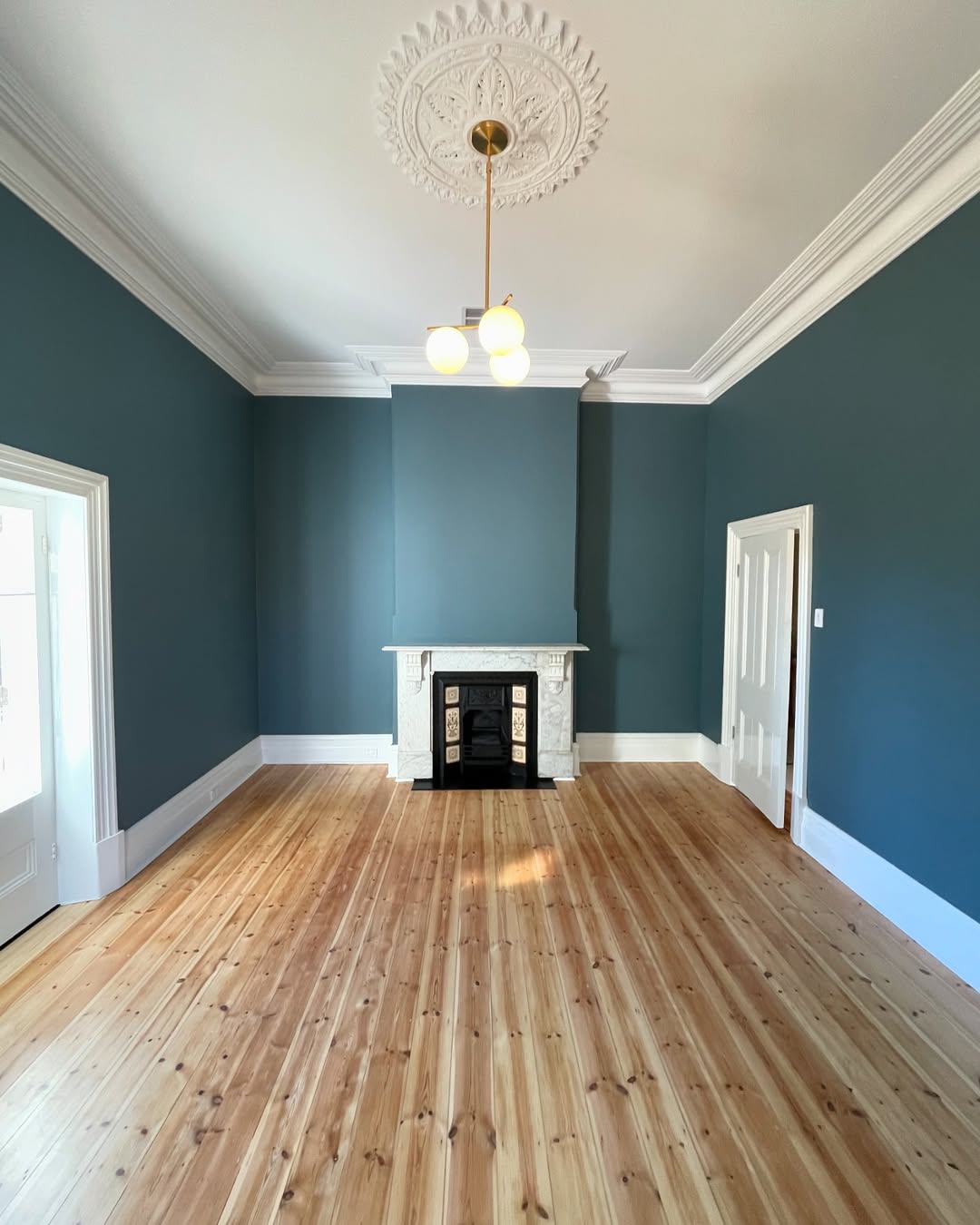 Restored Mitcham room with timber floor, fireplace, ceiling rose and cornice detail