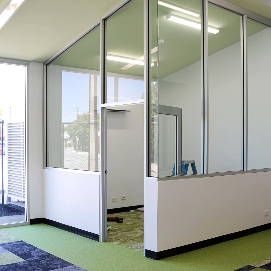 Glazed library office partition during Mount Carmel College renovation