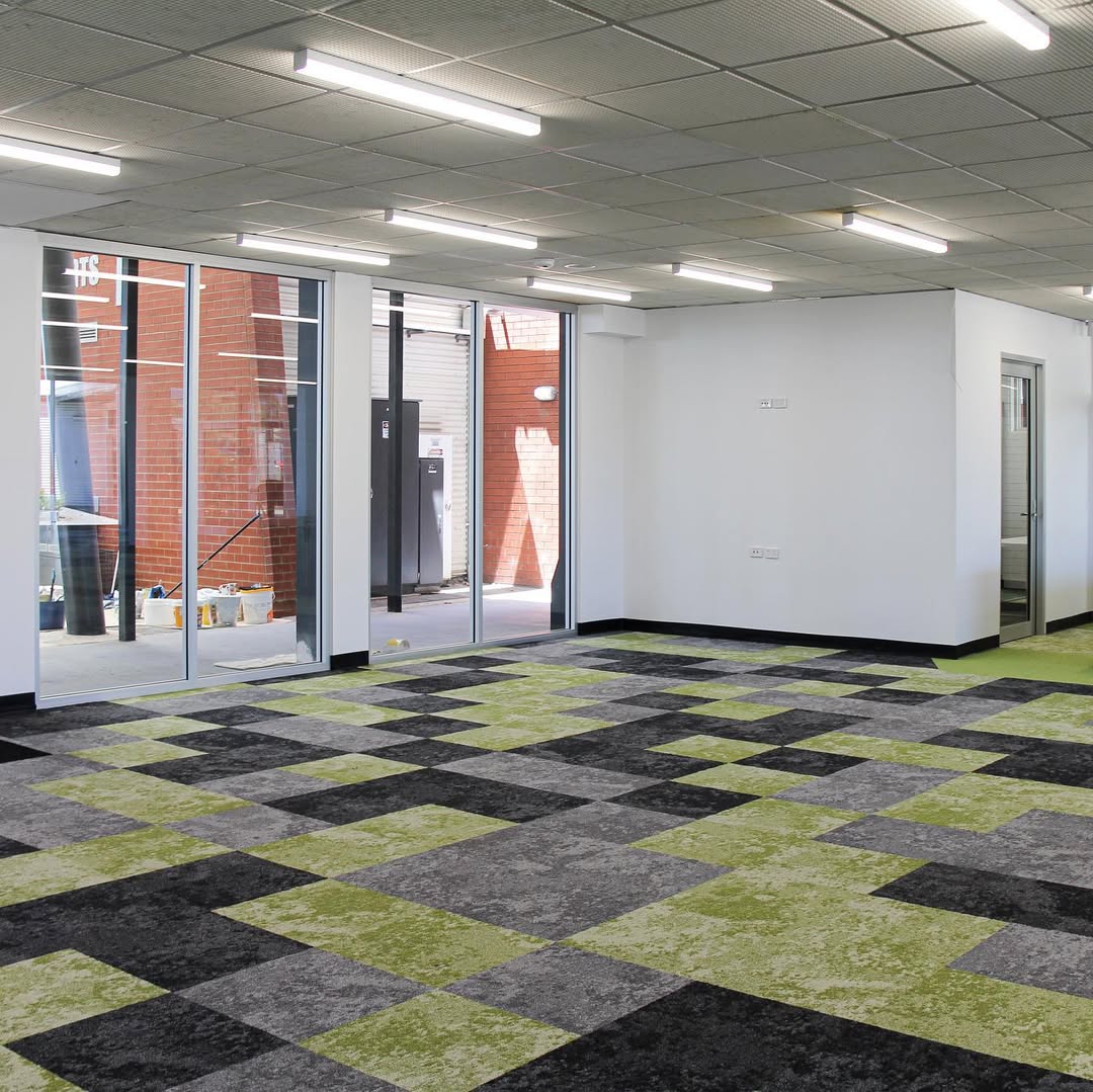 Finished Mount Carmel College library space with carpet tiles and natural light